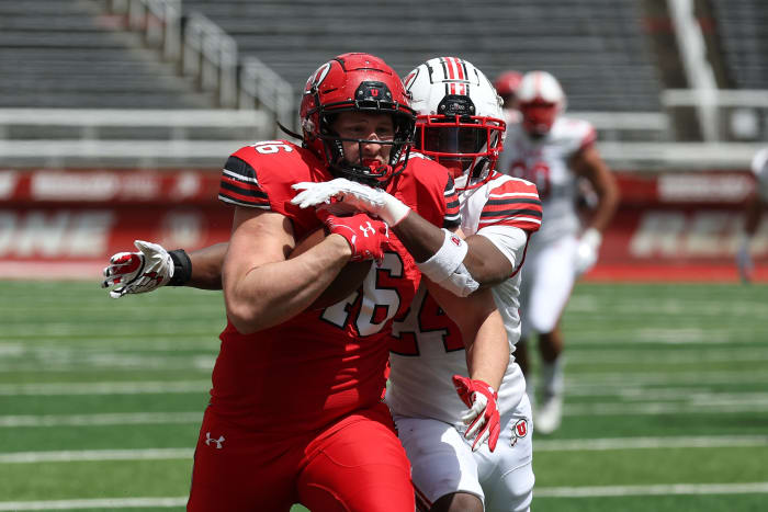Apr 23, 2022; Salt Lake City, Utah, USA; Utah Utes redshirt freshman tight end Hayden Erickson (46) runs with the ball after a catch against \"Utah Utes redshirt freshman safety Darrien \"\"Bleu\"\" Stewart (24) in the second half at Rice Eccles Stadium. Mandatory Credit: Rob Gray-USA TODAY Sports